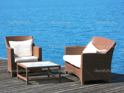 Romantic lakeside hotel terrace at sunset